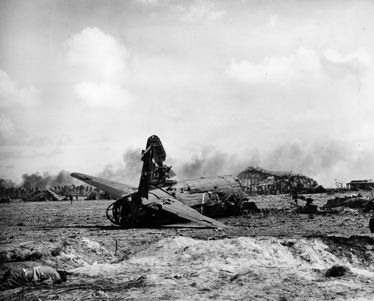 Airfield destruction and wrecked aircraft, "Zero" and Betty" types on the island of Roi in the Kwakjalein after invasion, February 1944. From the VADM Robert C. Giffen Photo Collection. 