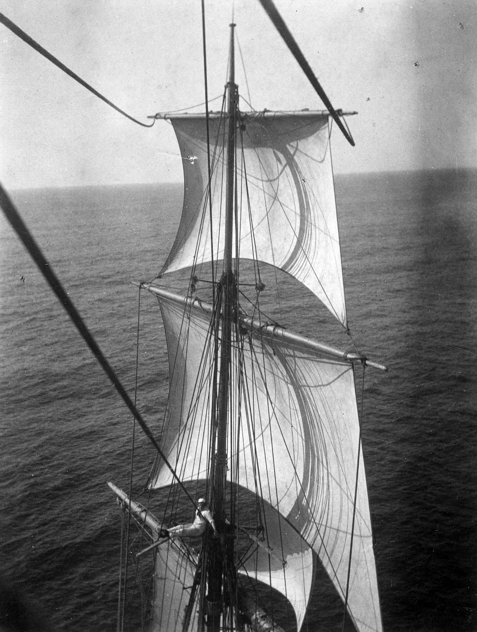 A midshipman sitting in the rigging on the training vessel USS Chesapeake, 1902. He is a member of Naval Academy class of 1905. Image is from the Clarence Grace Collection.