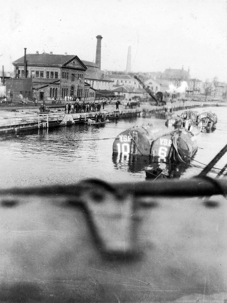 S-4 and pontoons entering drydock in Boston, March 1928. The tow arrived in Boston just ahead of a northeast storm. 