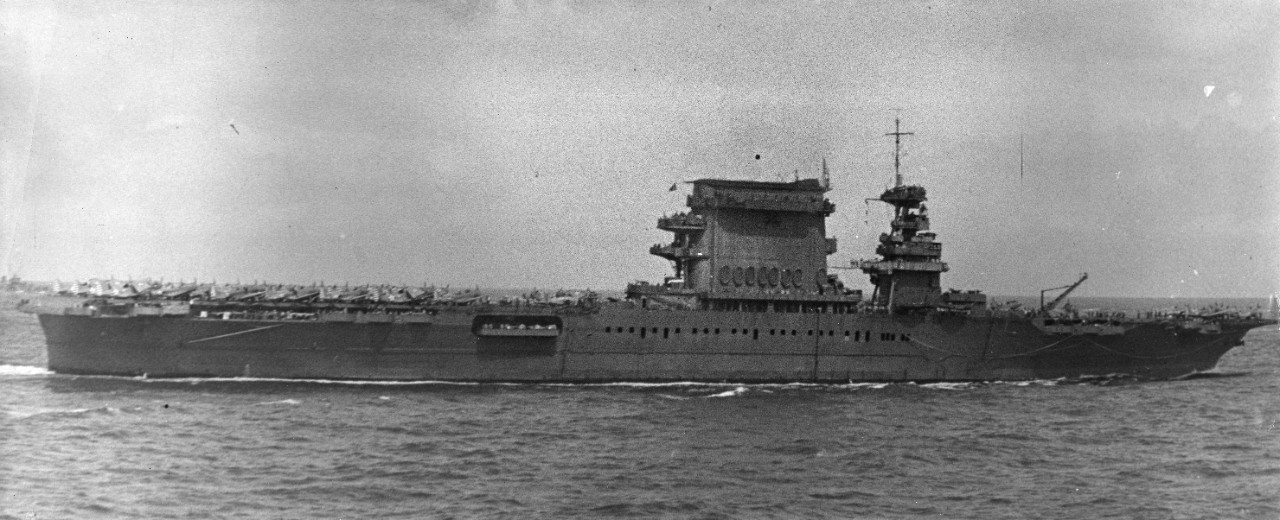 4 black and white photos taken during the Battle of the Coral Sea, 8 May 1942, showing USS Lexington (CV-2) before sinking. Views taken from USS Portland (CA-33). All images have been assigned NH numbers.