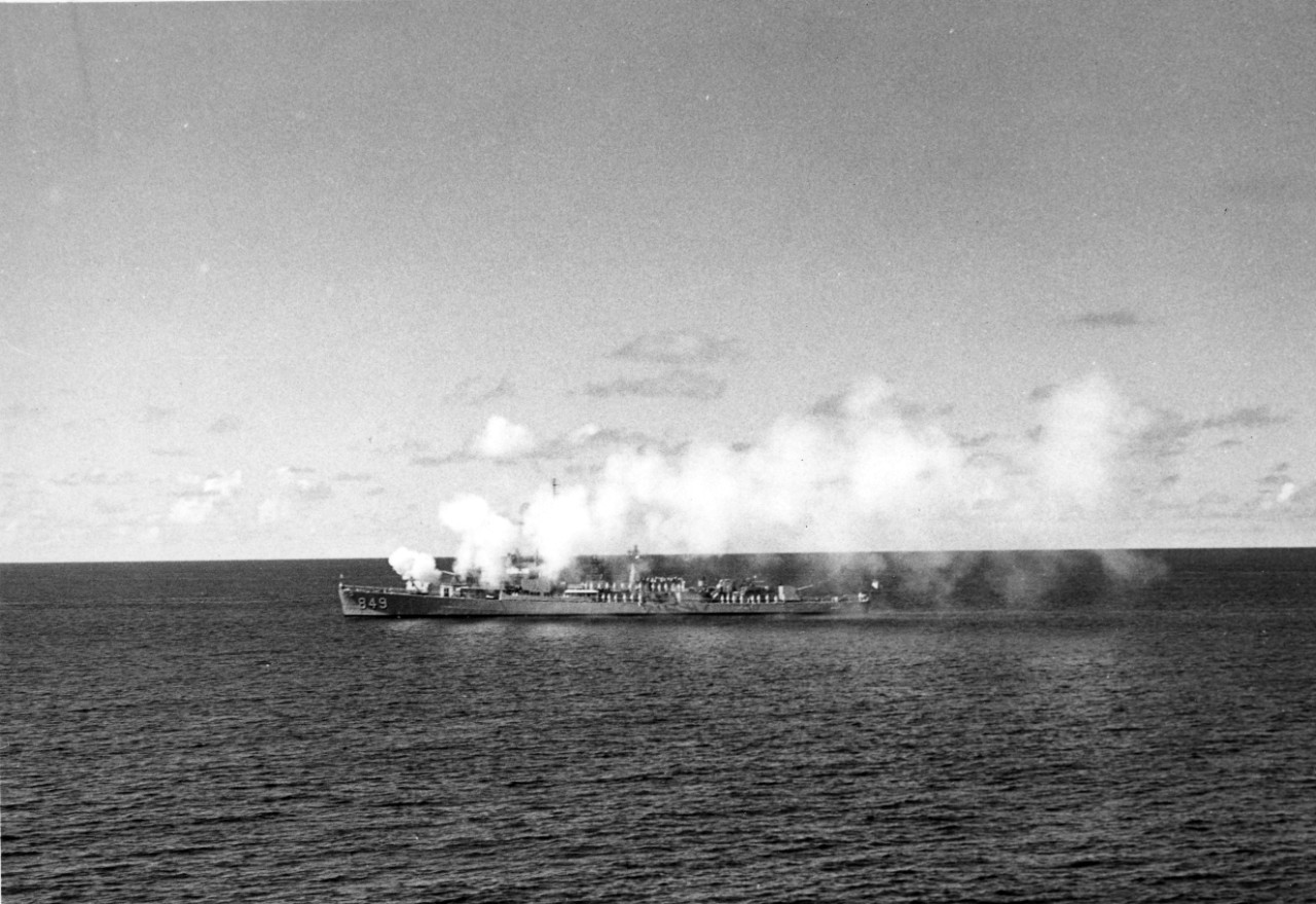 Single photograph of USS Richard K. Kraus (DD-849) during the commemoration of the first salute to the flag of the United States onboard US Brig-of-War Andrew Dorea, fired from the fort of Saint Eustatius (Netherlands Antilles) on 16 November 1776. The Richard E. Kraus is answering the salute of the fort, 185 years later on 16 November 1961. 