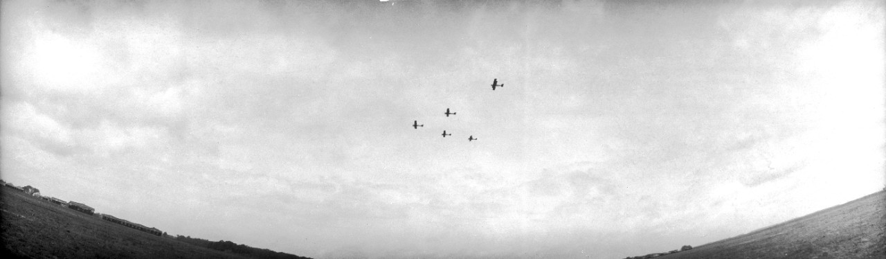 US Army DH-4 airplanes in formation over Langley Field, Virginia. Occasion may be the 1921 Army-Navy bombing exercises off the Virginia capes.