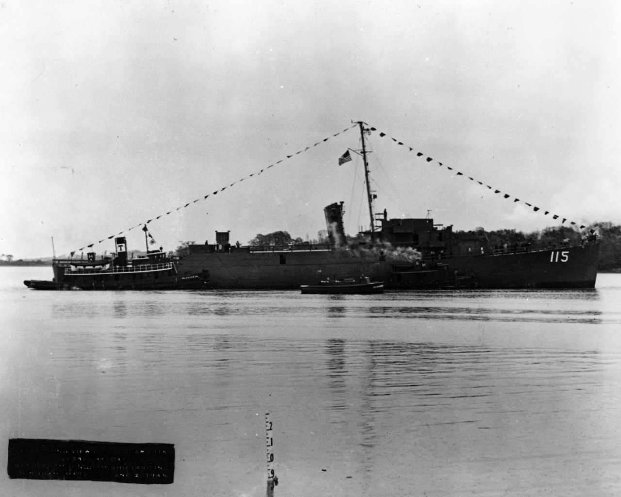 USS Rogers Blood (APD-115), assisted by tugs at Hingham, Massachusetts