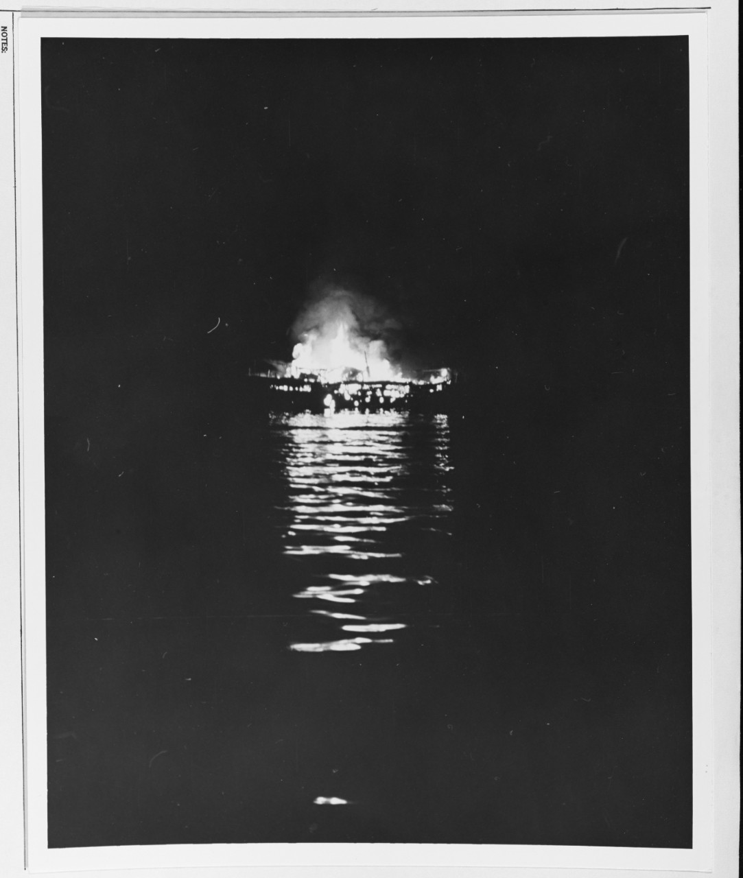 A Japanese lugger in flames off the Coast of Cebu. 