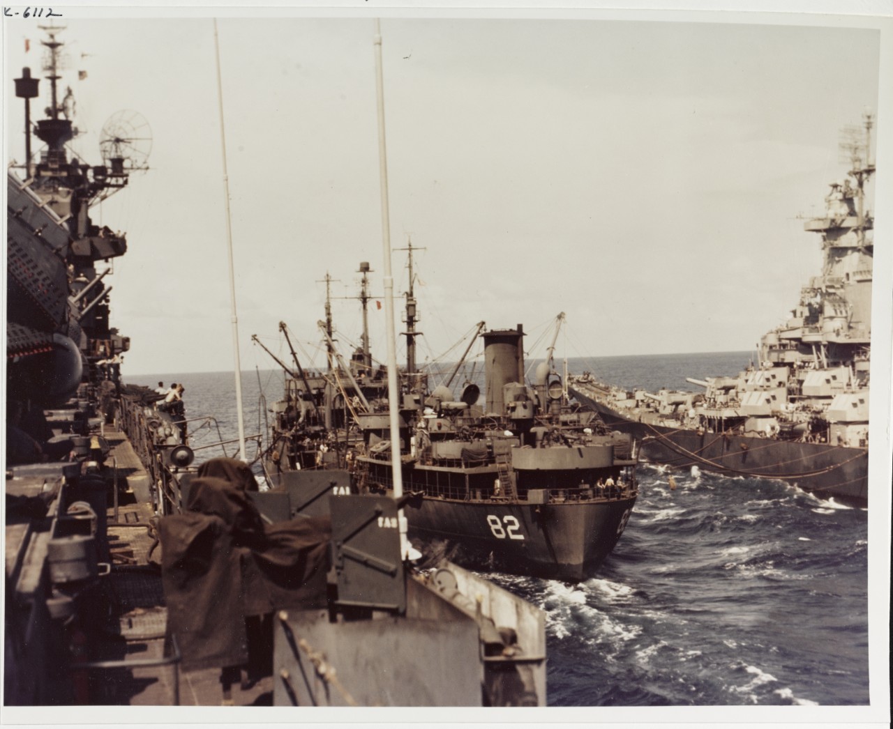 USS CAHABA (AO-82) refuels USS IOWA (BB-61) and an aircraft carrier (either TICONDEROGA, RANDOLPH, or SHANGRI-LA) in the Pacific, 1945