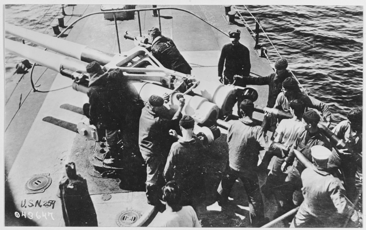 Firing twin guns on USS STOCKTON.