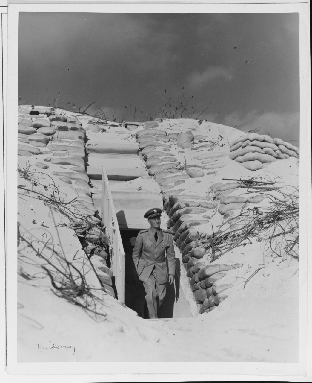 Admiral Chester W. Nimitz, USN (CINCPAC) is shown in the Doorway of a Bunker