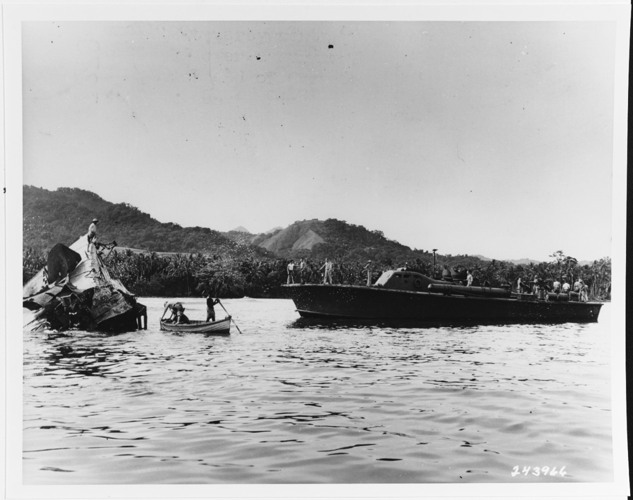 I-1 (Japanese SS, 1924) is examined by Army Intelligence personnel as USS PT-65 stands by, February 11, 1943