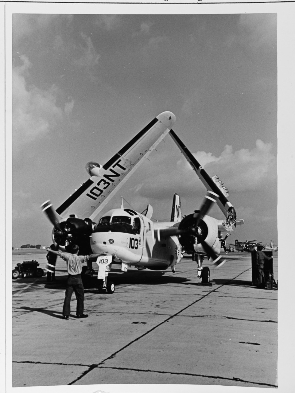 The pilot of A S-2E tracker anti-subMarine airplane Tolo unfold the wings.