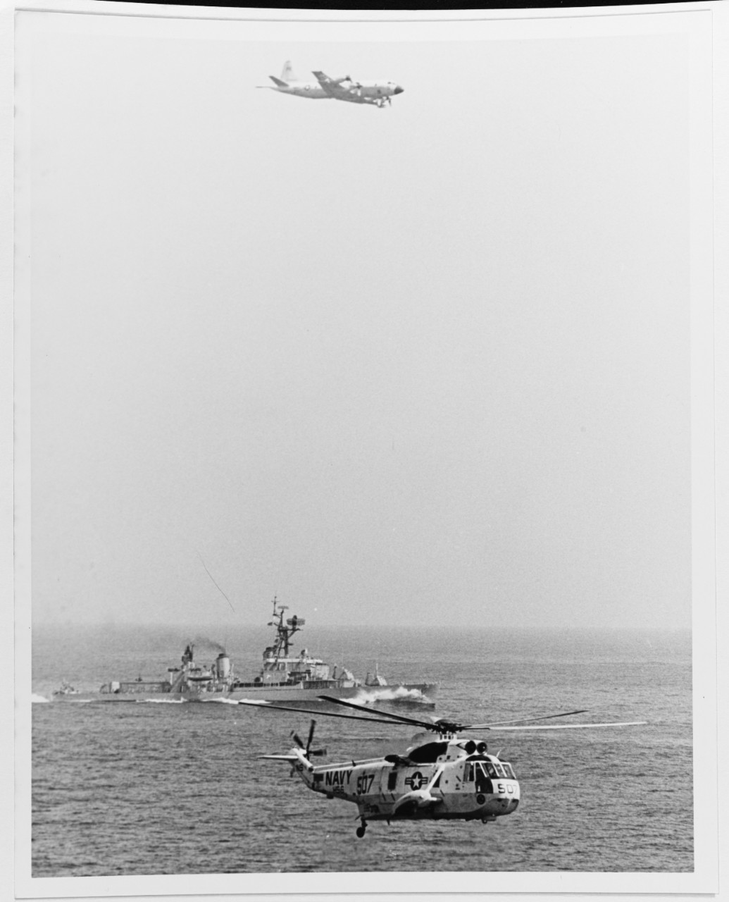 A P-3 Orion Anti-Submarine Warfare Plane, USS BUCK (DD-761), and a SH-3 Sea King Anti-Submarine Warfare Helicopter