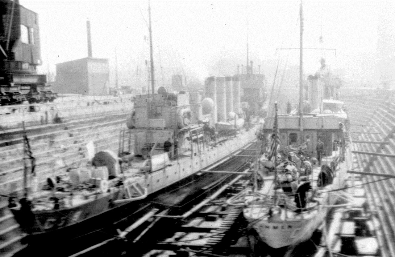 Ammen in dry dock, with another Coast Guard destroyer at left (unidentified). (U.S. Coast Guard Historian’s Office Photograph)