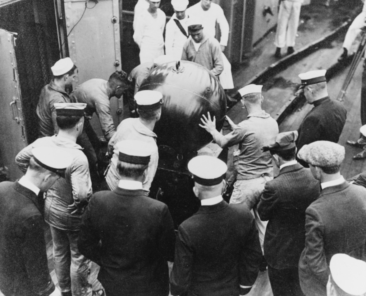 Mine handling operations on board Baltimore, 1920. Note what appears to be a mine elevator at left. Donation of Cmdr. Christopher Noble, USN (Retired), February 1967. (Naval History and Heritage Command Photograph NH 56330)