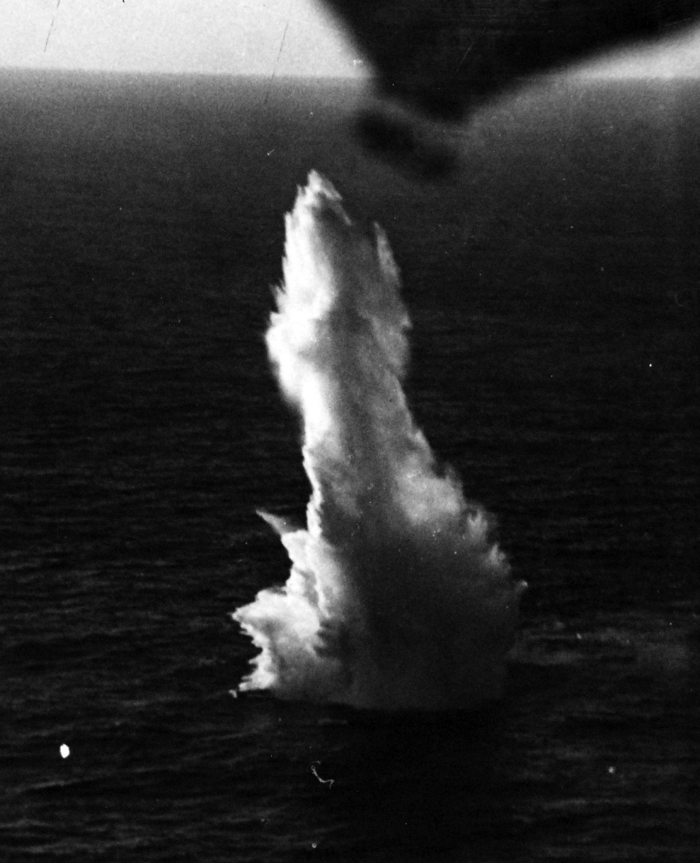 One of the Avenger’s bombs explodes during the battle, 24 August 1943. U-185’s bow protrudes from the bottom of the explosion in this photograph snapped by the plane. (Unattributed U.S. Navy Photograph 80-G-77195, National Archives and Records Ad...