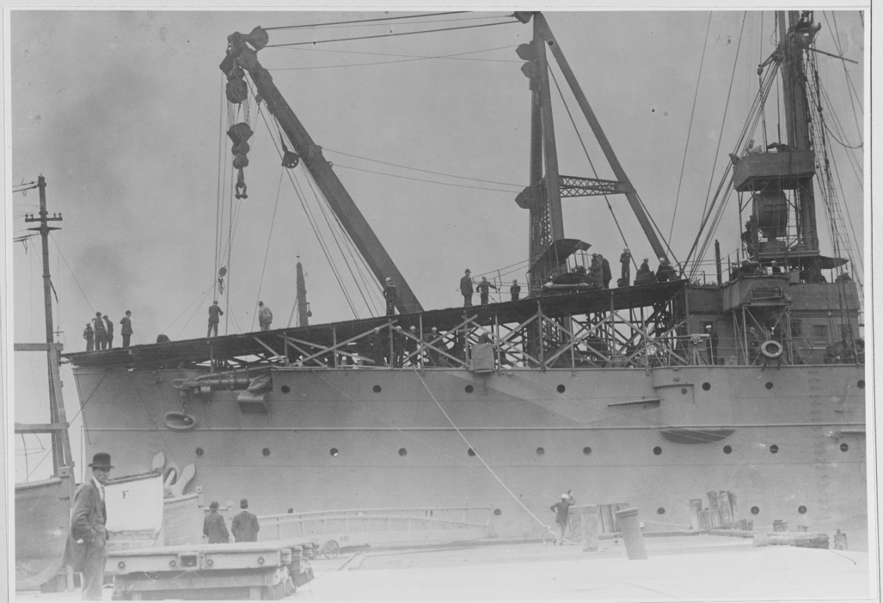 Sailors prepare Eugene B. Ely and his Curtiss Model D Pusher airplane to launch from the deck of Birmingham in Hampton Roads, 14 November 1910. The ship will shortly stand down the channel for the momentous flight. (U.S. Navy Photograph 902872, N...