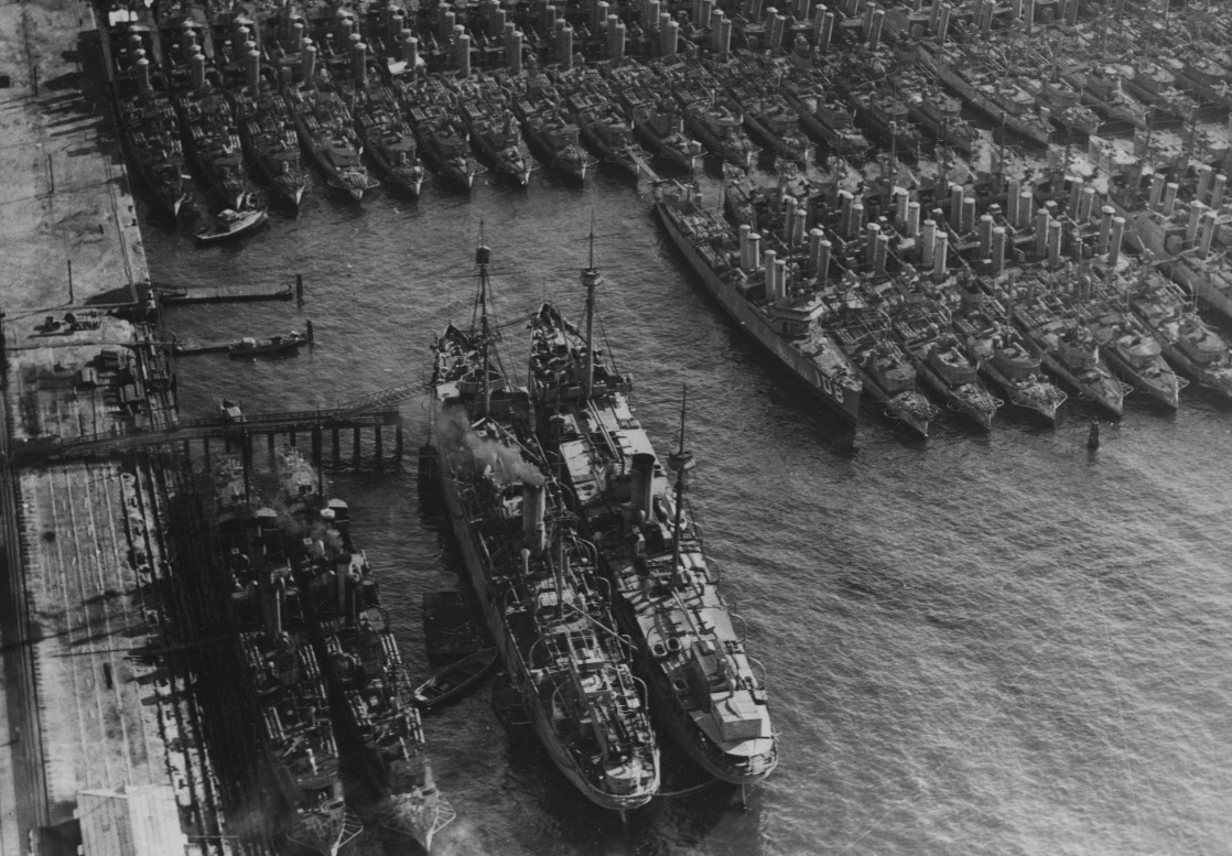 Buffalo and Prairie (AD-5) lie moored in the foreground at the Destroyer Base, San Diego, on 8 December 1922, with at least 50 wartime-construction destroyers, including Williams (DD-108) (identifiable to the right of Buffalo and Prairie) in the ...