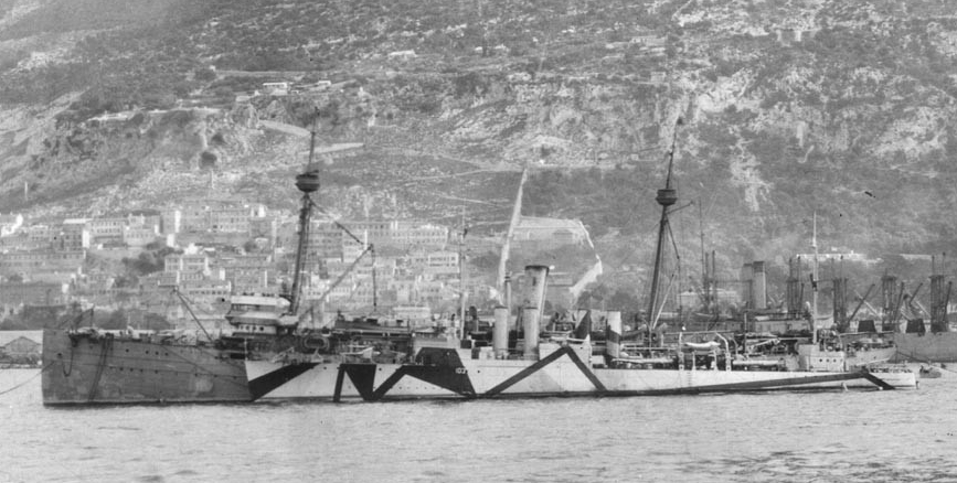 Buffalo at Gibraltar circa December 1918, with Schley (Destroyer No. 103) alongside and the collier Jupiter (Fuel Ship No. 3) in the background. Note that Schley is still wearing pattern camouflage, while Buffalo has been repainted into overall g...