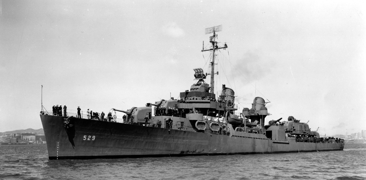 Five days after commissioning, 15 May 1943, Bush stands out in Measure 21, Navy Blue, in San Francisco Bay. Note workmen perched aloft, working on antennae. (U.S. Navy Bureau of Ships Photograph BS-45135, National Archives and Records Administrat...