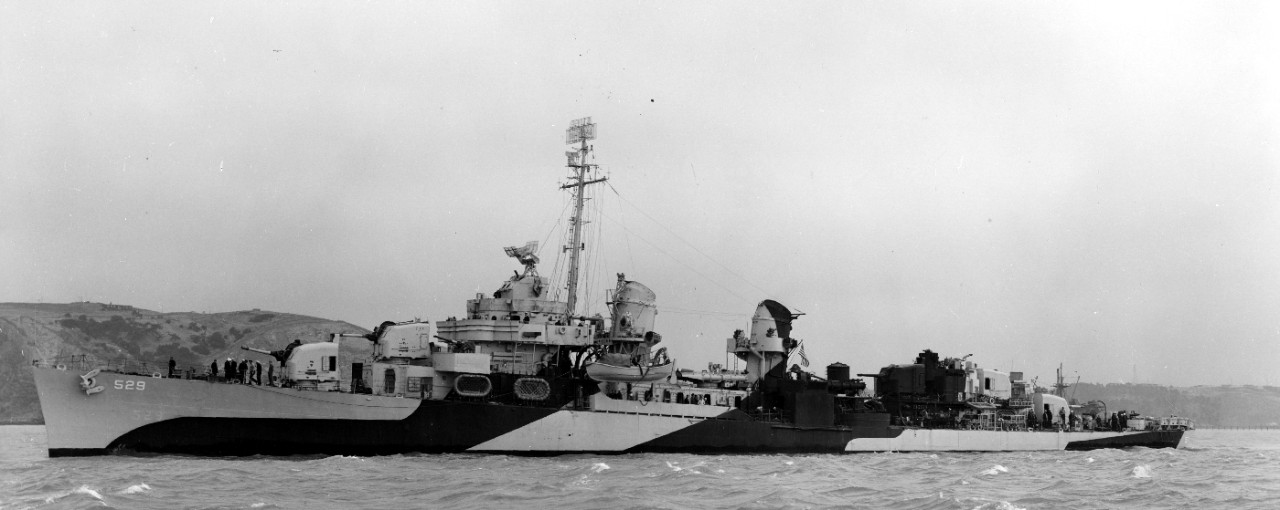 Underway near Mare Island, Bush, painted in Ocean Gray (5-O) and Black, stands down the channel, 11 June 1944. Note the different bridge configuration from that with which she had been completed, and the heavier armament forward, with twin-mount ...
