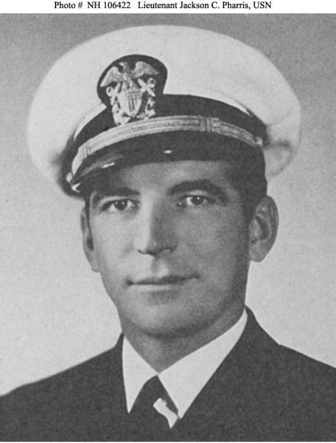 A halftone reproduction of a photograph of Gunner Jackson C. Pharris, who receives the Medal of Honor for his extraordinary conduct on board on 7 December 1941. The award later disappears after Pharris died on 17 October 1966, however, and his daughter stores the medal in a safe deposit box but then unexpectedly passes away. As the medal is not covered in her will, it becomes the property of the State of California. New legislation allows the state to contact the family to reunite them with the medal, and on 2 October 2007, Vice Adm. Terrance T. Etnyre, Commander Naval Surface Forces, oversees a ceremony at his headquarters in San Diego to return the medal to Pharris’ family. “It is my distinct honor to remember a surface force hero and to reunite a family with a lost family treasure,” Etnyre observed. “On behalf of my family,” Lt. Col. Jackson Pharris II, USMC (Ret.), the Gunner’s son, said, “I would like to thank you very much for returning it to us…I would like to accept it on behalf of those who have served in the past and those who are serving today.” (Unattributed U.S. Navy Photograph NH 106422, Photographic Section, Naval History and Heritage Command)