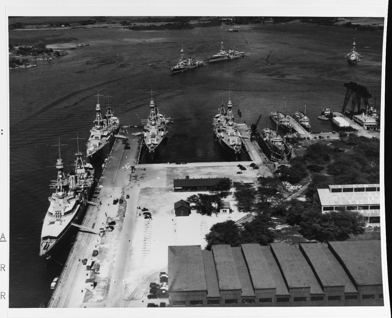 Scouting Force ships at, and off, Pearl Harbor Navy Yard, T.H., 2 February 1933. The heavy cruisers tied up at 1010 Dock are (from left to left center) Augusta (CA-31), Chicago (CA-29) and Chester (CA-27). Northampton lies alongside the dock in t...