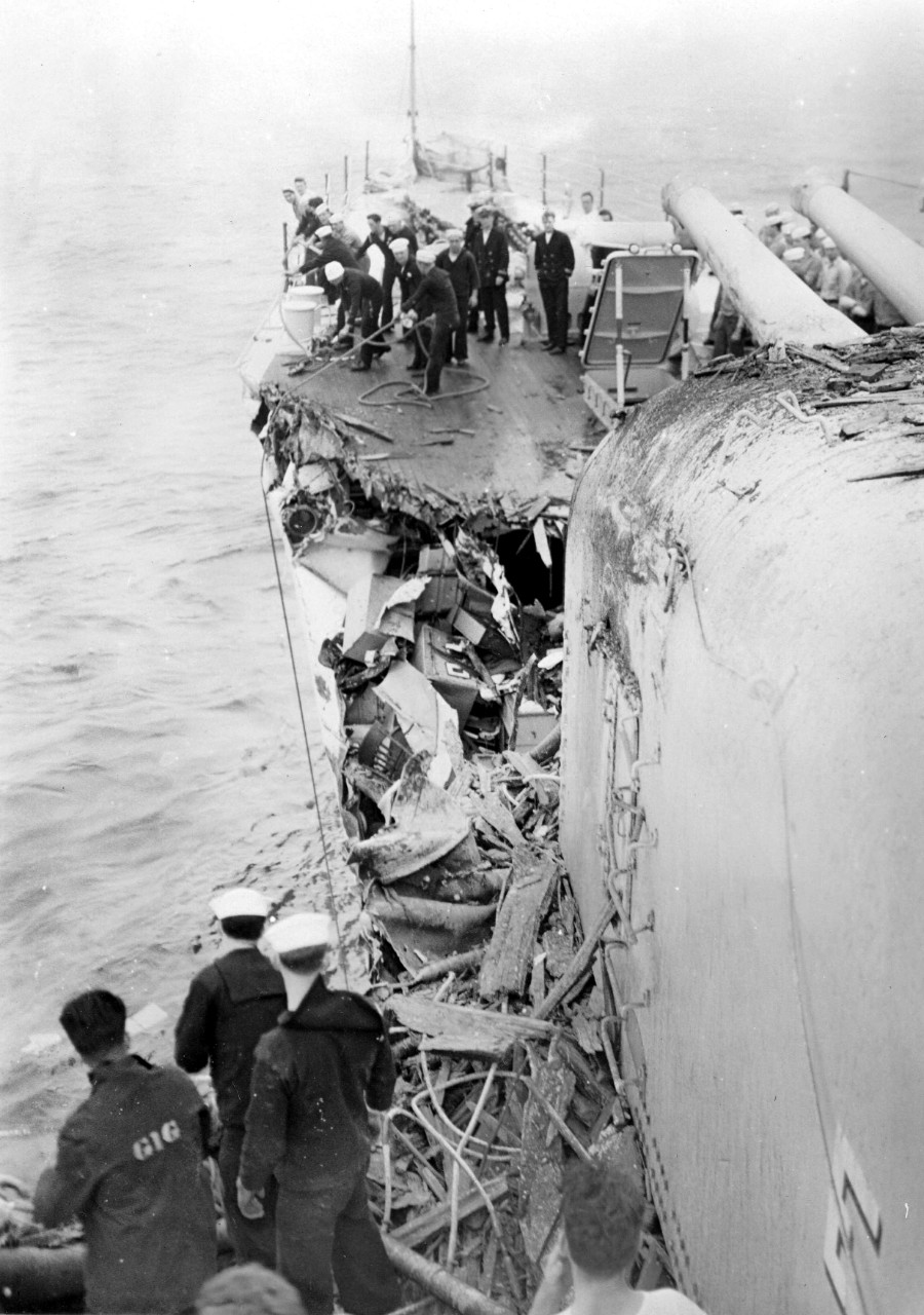 Damage control in the wake of the collision with Silverpalm. Note the extent of the tangled wreckage on the port side, amidst which one can identify a chair that was apparently in one of the obliterated staterooms. Sailor at left foreground was a...