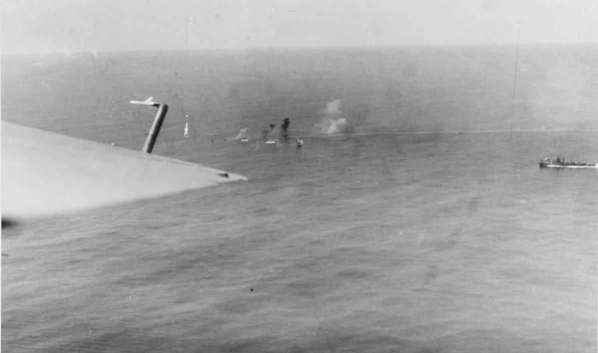 Corry (top right) advancing towards, and firing upon U-801 on 17 March 1944. (U.S. Navy Photograph 80-G-222848, National Archives and Records Administration, Still Pictures Division, College Park, Md.)
