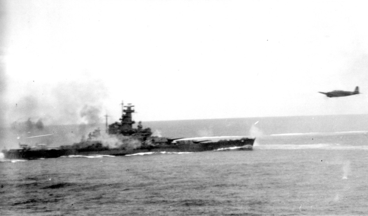 A Japanese Nakajima B5N2 Type 97 carrier attack plane hurtles past South Dakota during the Battle of the Santa Cruz Islands, 26 October 1942. The aircraft -- probably one of Imajuku’s Nakajima B5N2 Type 97 carrier attack planes -- has apparently ...