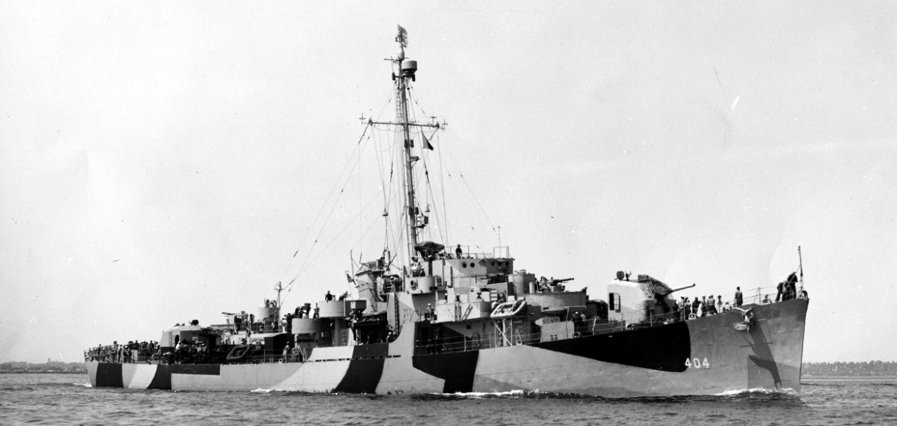 Three-quarter starboard bow view of Eversole getting underway from Boston Harbor on 20 May 1944, en route to Norfolk, Va. (U.S. Navy Bureau of Ships Photograph BS-132126, National Archives and Records Administration, Still Pictures Division, Coll...