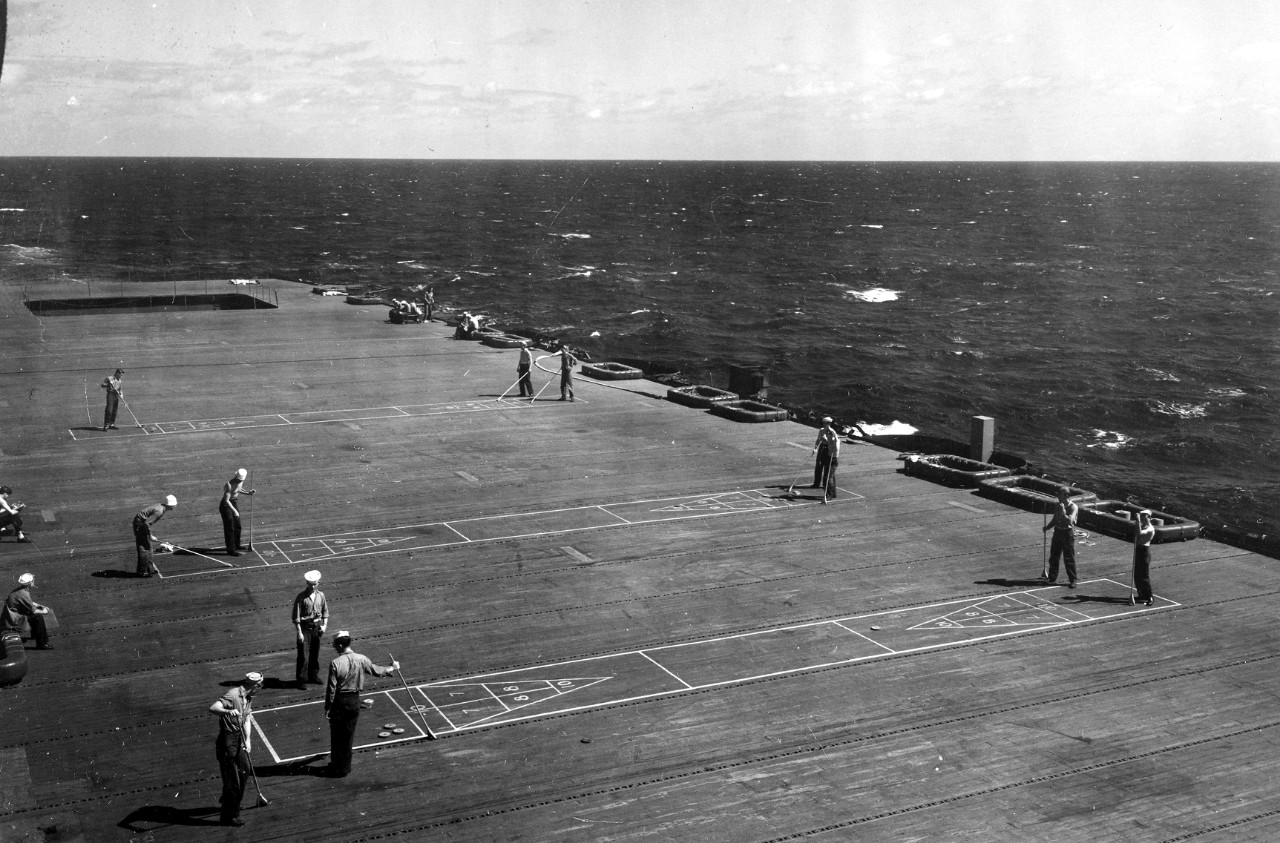Cruise ship or carrier? Sailors play shuffleboard on Fanshaw Bay’s flight deck, 25 October 1945. (U.S. Navy Photograph 80-G-364261, National Archives and Records Administration, Still Pictures Division, College Park, Md.)