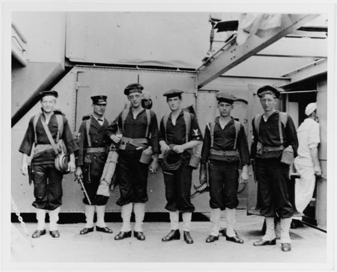 Signalmen of Florida's Landing Force, before going ashore at Veracruz, Mexico, in April 1914. These men are identified as: Windrell, Repp, C.M.M., Green and Bishop (only five listed). Note their military pistol belts with suspenders, canteens and other field gear. Several men are wearing their flat hats beret-style, without grommets. Photograph and caption were provided by Chaplain C.H. Dickins, USN, 1926. (U.S. Naval History and Heritage Command Photograph NH 63286)