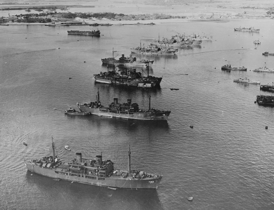 A group of prospective target and support ships for Operation Crossroads (the Bikini Atomic Bomb tests) lying at anchor at Pearl Harbor. Ships present from front to rear include Crittenden (APA-77) and several of her sister ships, Catron (APA-71)...