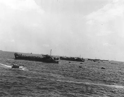 APA-106-3: Tank landing ships (LSTs) offshore during the fierce fighting for Iwo Jima, 19 February 1945.