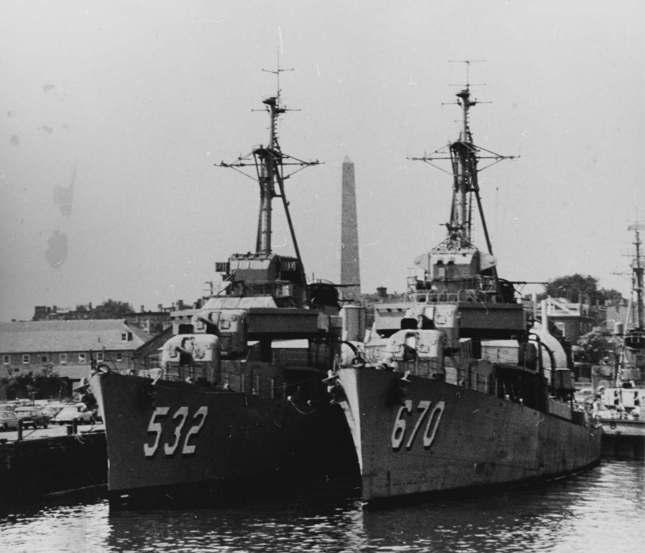 Heermann (pictured on the left) moored alongside Dortch (DD-670) at the Boston Naval Shipyard, shortly before both destroyers were transferred to Argentina in August 1961. Note the Bunker Hill Battle Monument in the background. (Naval History and...