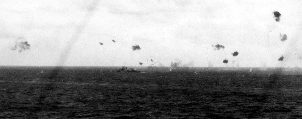 A kamikaze sets his sights on Helm, 5 January 1945, as seen from Wake Island (CVE-65). (U.S. Navy Photograph 80-G-273082, National Archives and Records Administration, Still Pictures Division, College Park, Md.)