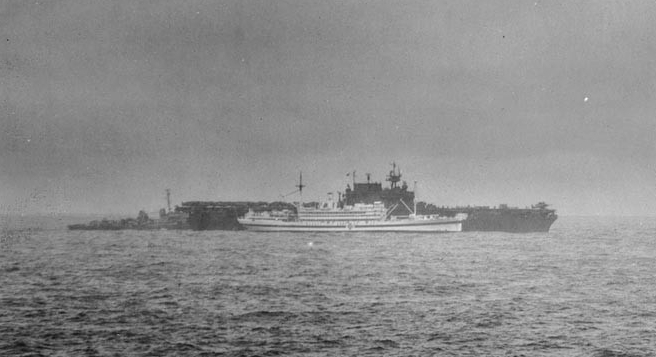 Enterprise (CV-6) transferring casualties to Bountiful on 15 May 1945, a day after the carrier was struck by a kamikaze. Cropped from Photograph NH 99384. Collection of Adm. Arleigh A. Burke, donated in 1973-75. (Naval History and Heritage Comman...