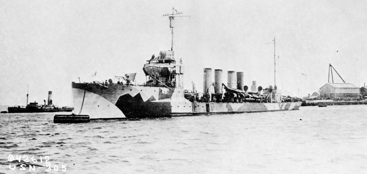 Jenkins moored in a European port (likely Queenstown), circa 1918, in “dazzle” camouflage. Note the splinter mattresses protecting her bridge and the shield on her forward 3-inch gun. (Naval History and Heritage Command Photograph NH 52009)