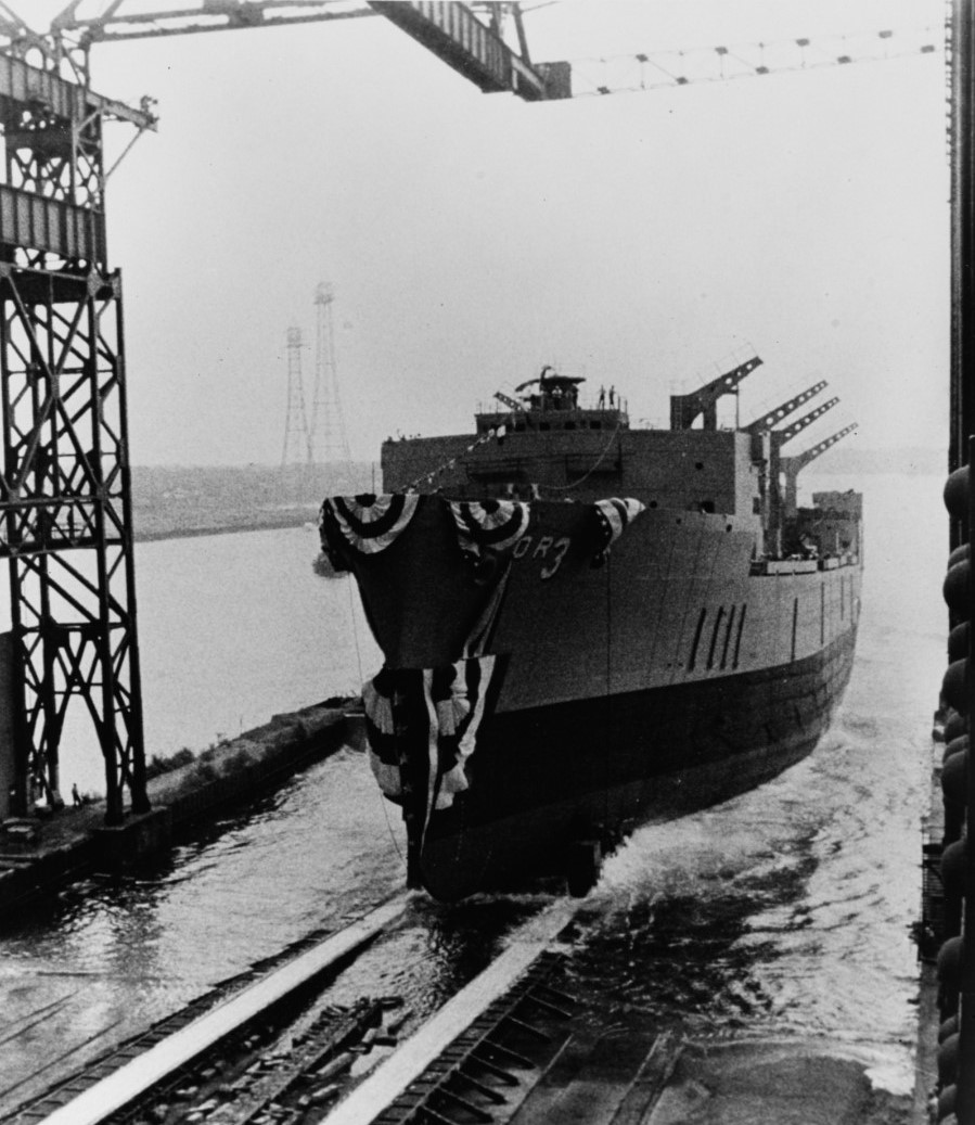 Kansas City slides down the ways at her christening at General Dynamics, Quincy, Mass., 28 June 1969. (Naval History and Heritage Command Photograph USN 1143691)
