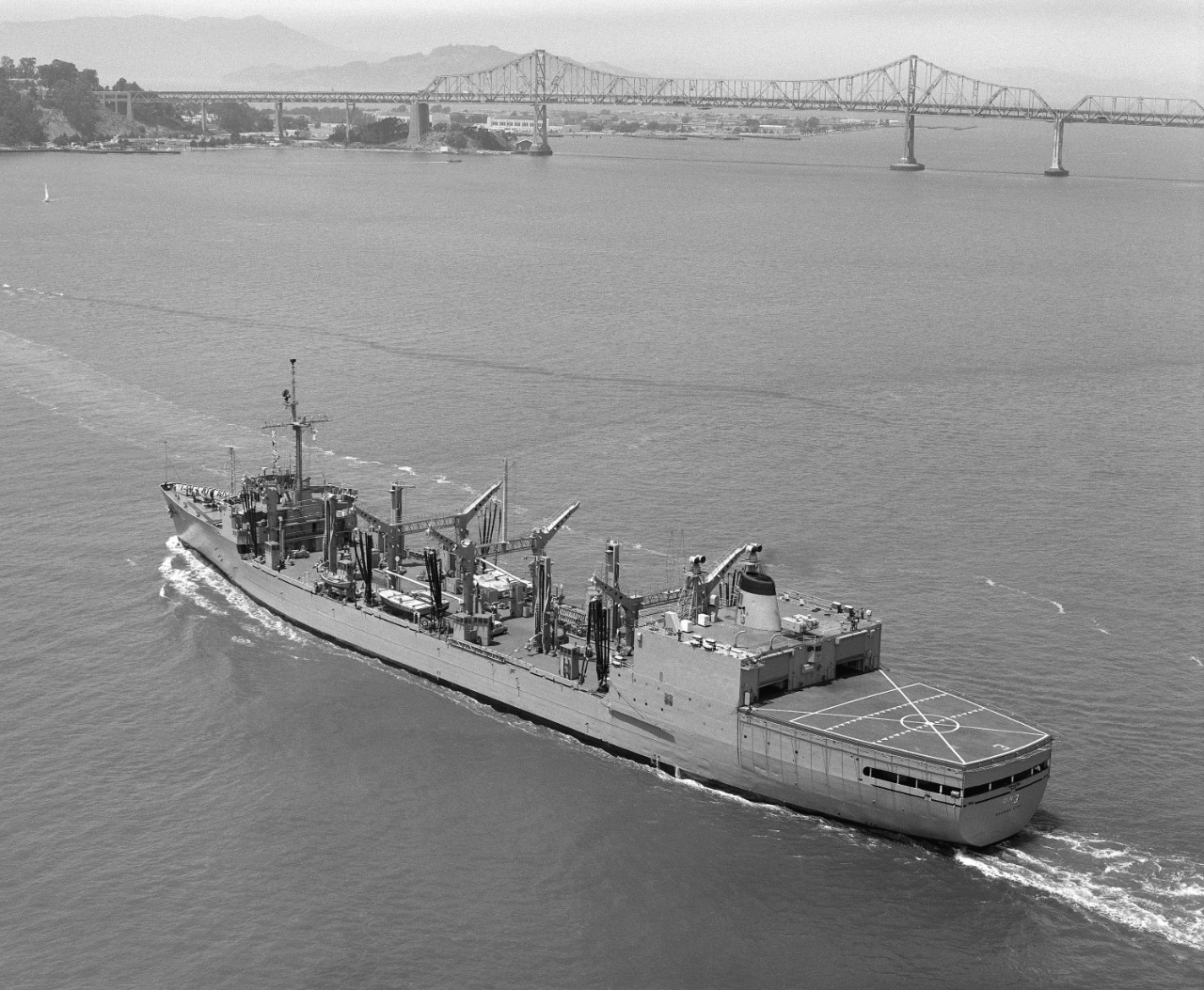 Kansas City underway in San Francisco Bay with the San Francisco-Oakland Bay Bridge in the background, August 1984. (U.S. Navy Photograph DN-SN-84-10221, National Archives and Records Administration, Still Pictures Division, College Park, Md.)