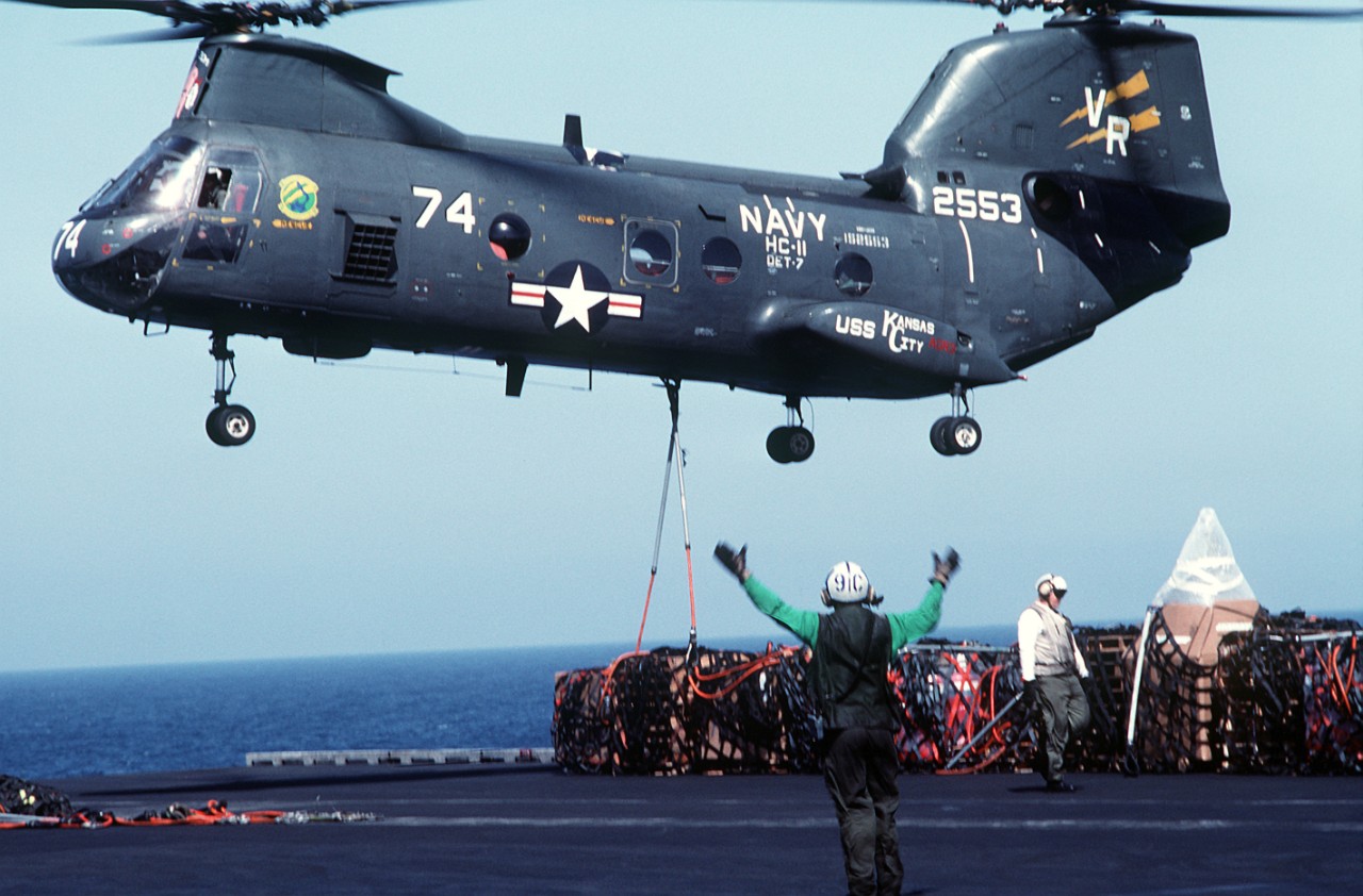 An HH-46D Sea Knight of Helicopter Combat Support Squadron (HC) 11 Detachment 7 assigned to Kansas City lowers a load of supplies to the flight deck of Ranger during a vertical replenishment in the Persian Gulf, April 1991. (U.S. Navy Photograph ...