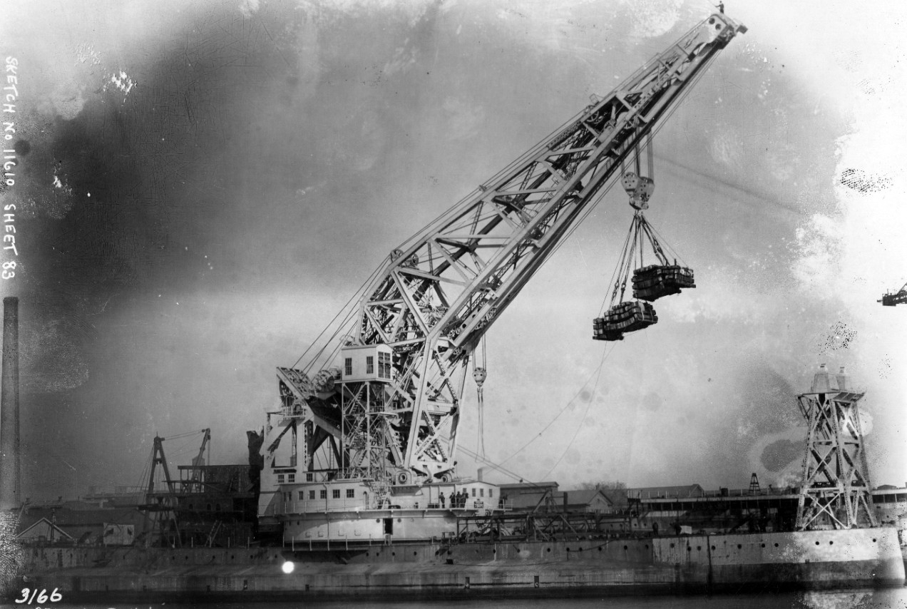 Testing continues on Crane Ship No. 1’s 250-ton revolving crane while she undergoes conversion at Philadelphia Navy Yard, 30 October 1922. The ship lifts a 312-ton load on the right and left main hoist with equalizer at 101-foot reach on an even ...