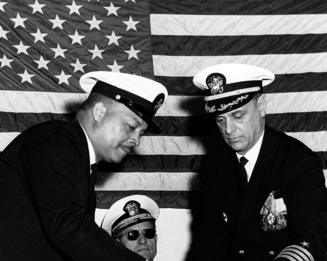 SDCS James R. Dawson presents the ship’s commissioning pennant to Capt. Leonard M. Nearman, her final commanding officer, following the hauling down of the colors during her decommissioning ceremony at Long Beach, 13 February 1970. (Naval History...