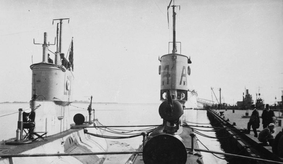 L-11, at left, and L-4 (Submarine No. 43) At the U.S. Naval Academy, Annapolis, Md., circa 1919. Note these submarines' 3-inch/23 deck guns, located just forward of their fairwaters. L-11's is retracted, while that of L-4 is in operating position...