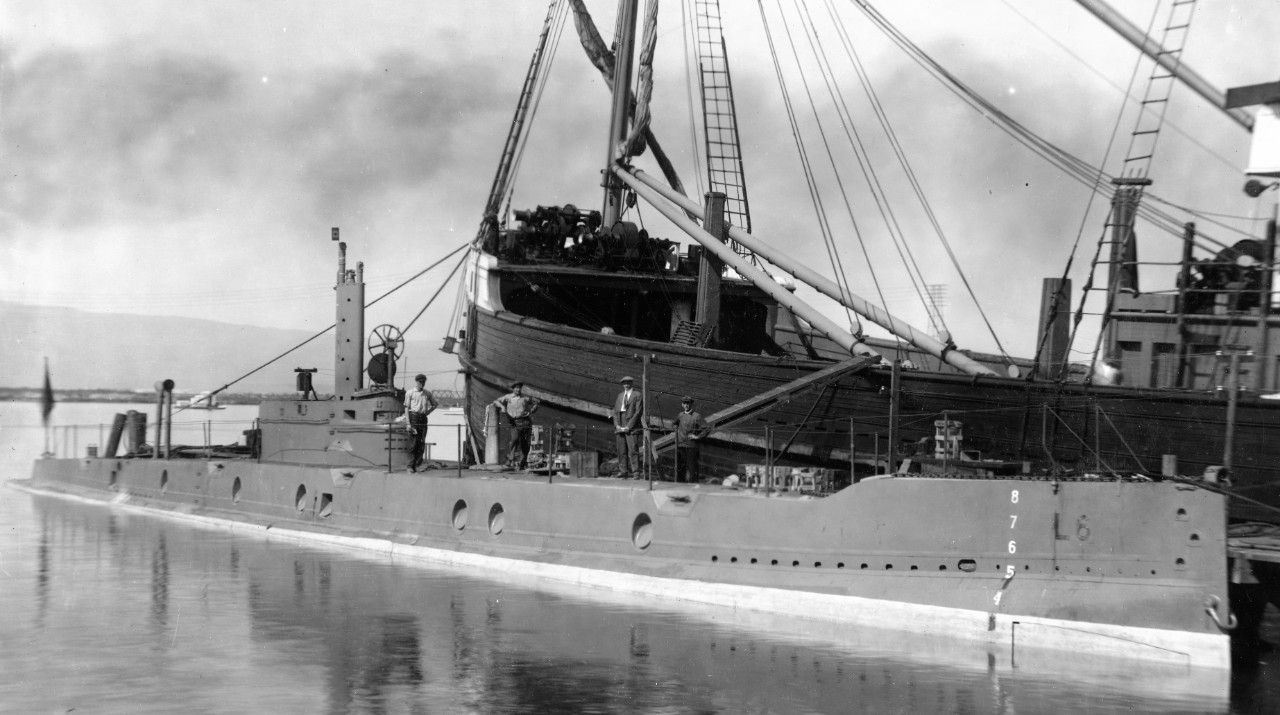 L-6 at her building yard, 30 September 1917. The men standing on deck serve as a useful yardstick to measure the size of this undersea craft. (U.S. Navy Bureau of Ships Photograph 19-N-1328, National Archives and Records Administration, Still Pic...
