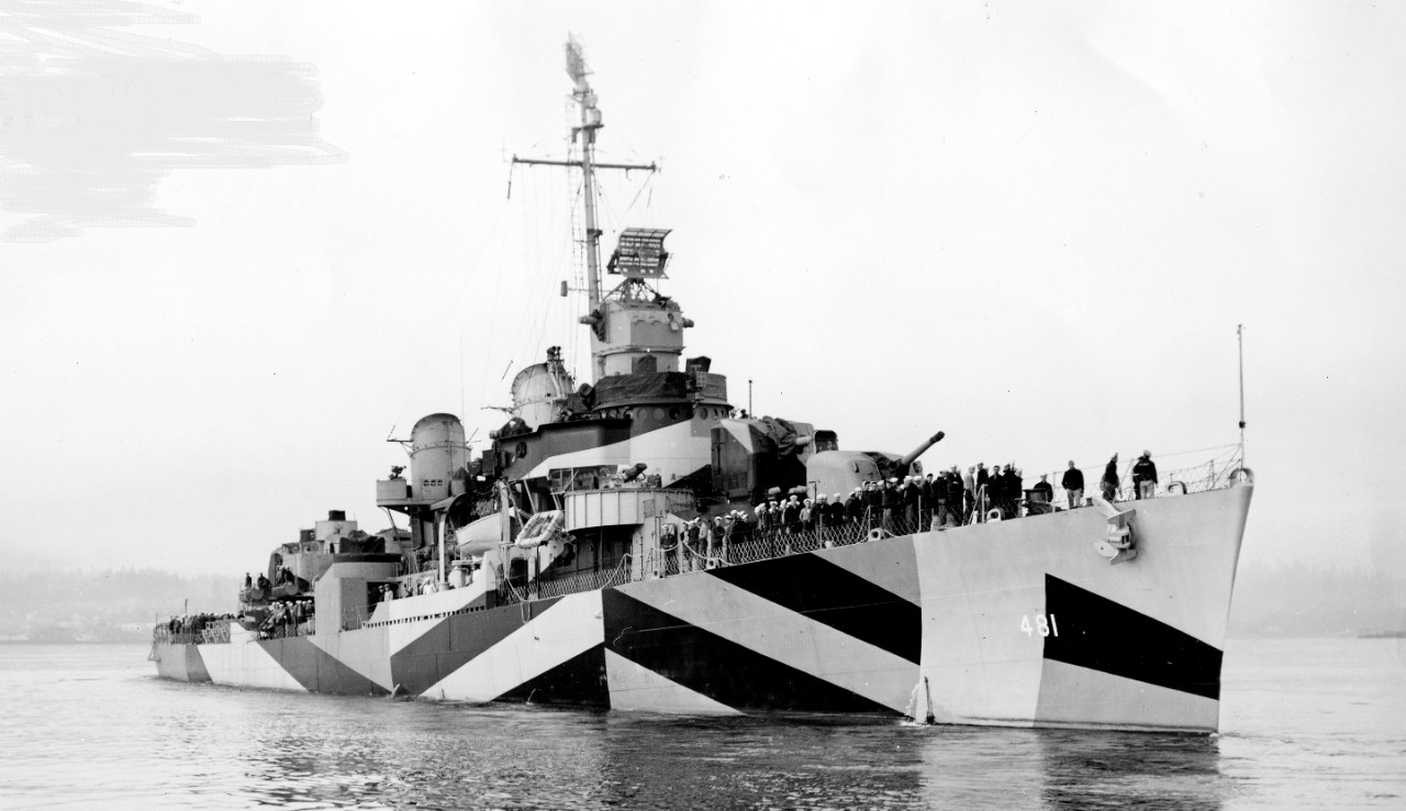 Starboard bow view of Leutze on a foggy day in Bremerton, 2 April 1944. Note her sailors (even the sentry with his slung Springfield ’03 rifle, among the men forward of Mt. 51) all looking toward the photographer. (U.S. Navy Bureau of Ships Photo...