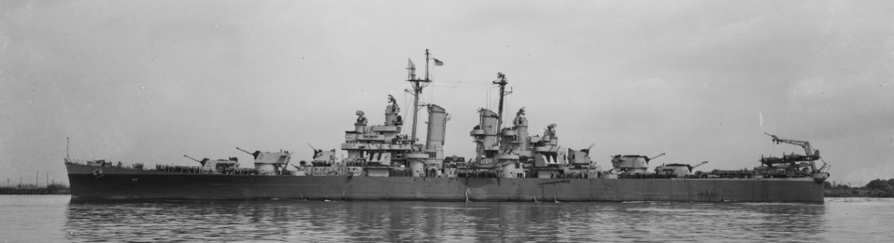 Little Rock off the Philadelphia Navy Yard, 1945, with her crew at quarters and two Curtiss SC-1 Seahawks on her catapults aft. (U.S. Navy Bureau of Ships Photograph 19-N-92423, National Archives and Records Administration, Still Pictures Divisio...