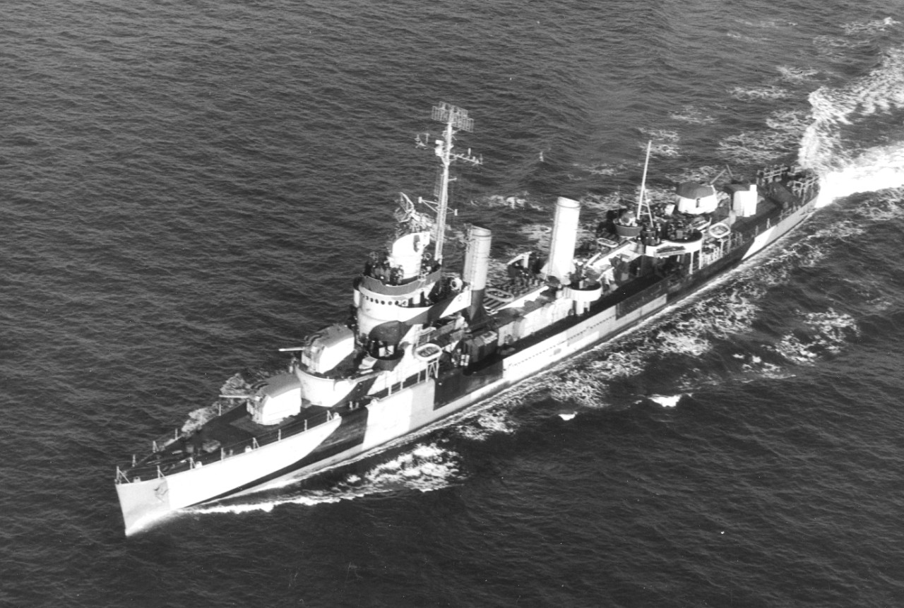 Livermore at sea, 7 December 1944, in pattern camouflage, with Mt. 51 and Mt. 52 trained slightly to starboard, as is the Mk. 37 director; stub mast aft supports high-frequency direction finder (HF/DF) antenna. (U.S. Navy Photograph 80-G-290565, ...
