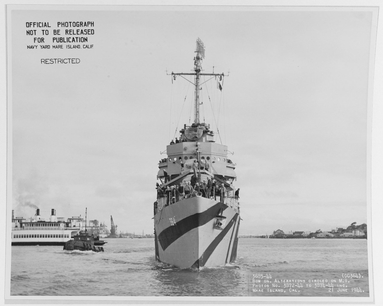 Bow-on view of Mahan, taken at Mare Island Navy Yard on 21 June 1944. Note the camouflage pattern carried around the stern in a continuous pattern. (U.S. Navy Bureau of Ships Photograph 19-N-67750, National Archives and Records Administration, St...