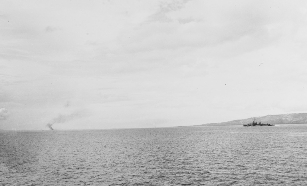 Mahan and Ward (APD-16) burning in the distance, during the landings at Ormoc, Leyte, Philippines, on 7 December 1944. Both ships received hits by kamikazes. (U.S. Navy Photograph 80-G-321974, National Archives and Records Administration, Still P...