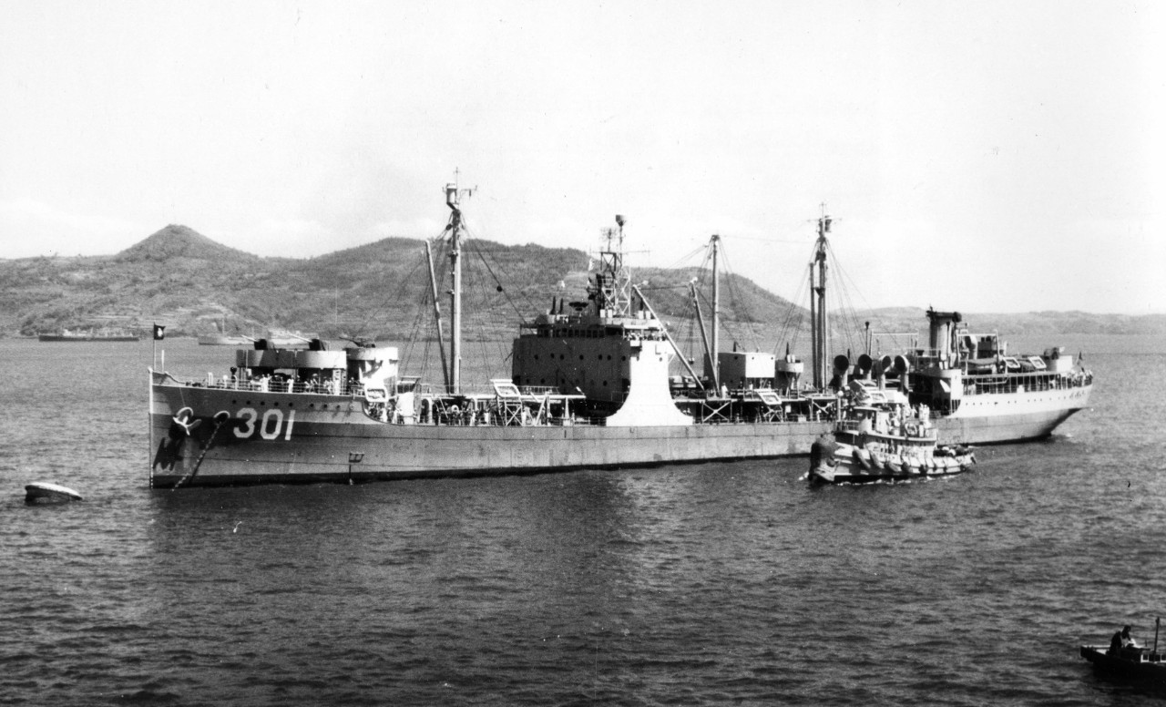 Painted in a graded scheme reminiscent of that worn during her time in the U.S. Navy during World War II, Omei (AO.301), ex-Maumee, lies moored to a buoy at Sasebo, Japan, on 1 July 1951, as seen from escort carrier Sicily (CVE-118). (U.S. Navy P...
