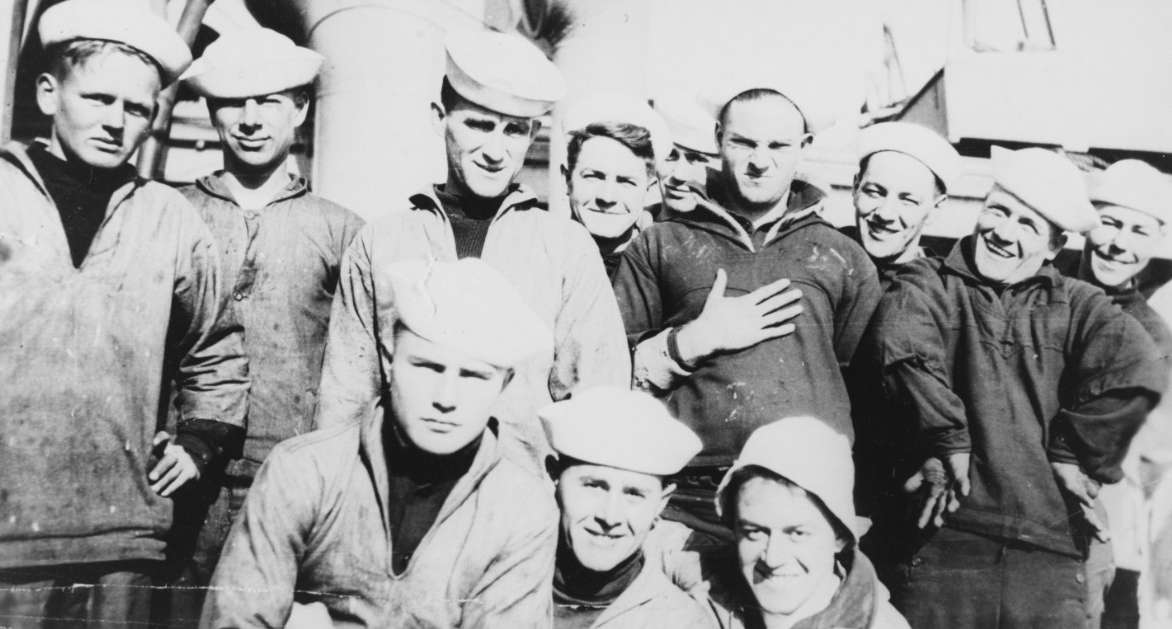 A group of sailors of the ship’s company pose for the photographer’s glass, 1917. One of the men, SN Hubert C. Rickert, stands defiantly with his hand on his chest. (Naval History and Heritage Command Photograph NH 93090)